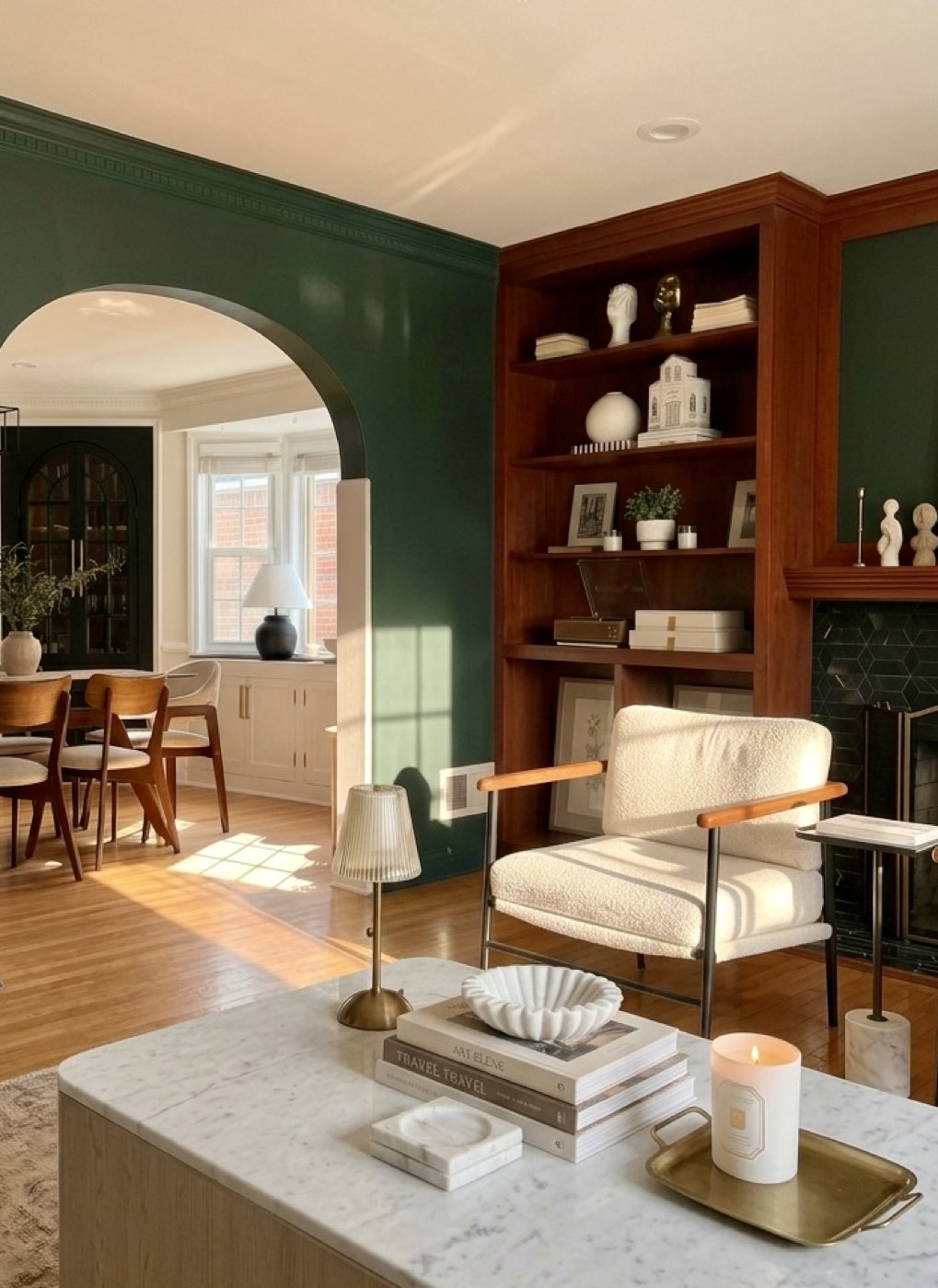 Living room with plaster archway and built-in bookshelf