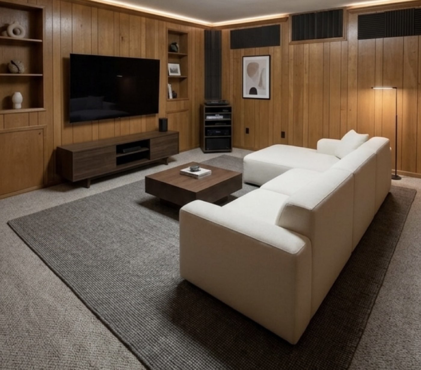 Wood-paneled media room with custom sectional